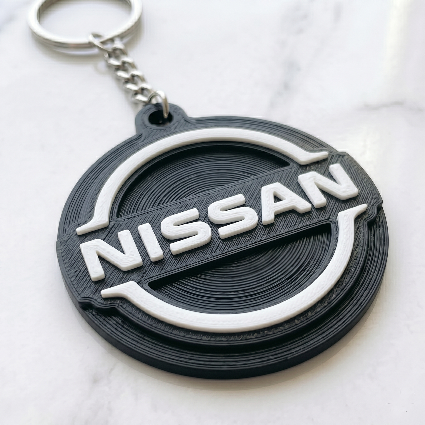 Nissan 3D Logo Keychain – Modern Stealth Edition